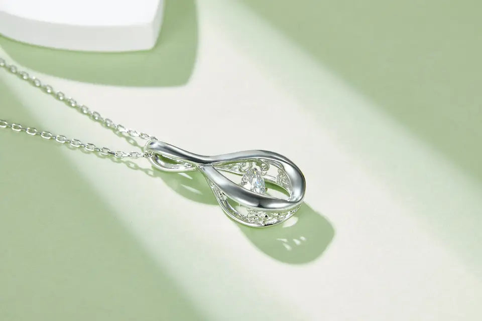 Spiral Dancing Moissanite Pendant Set in Sterling Silver