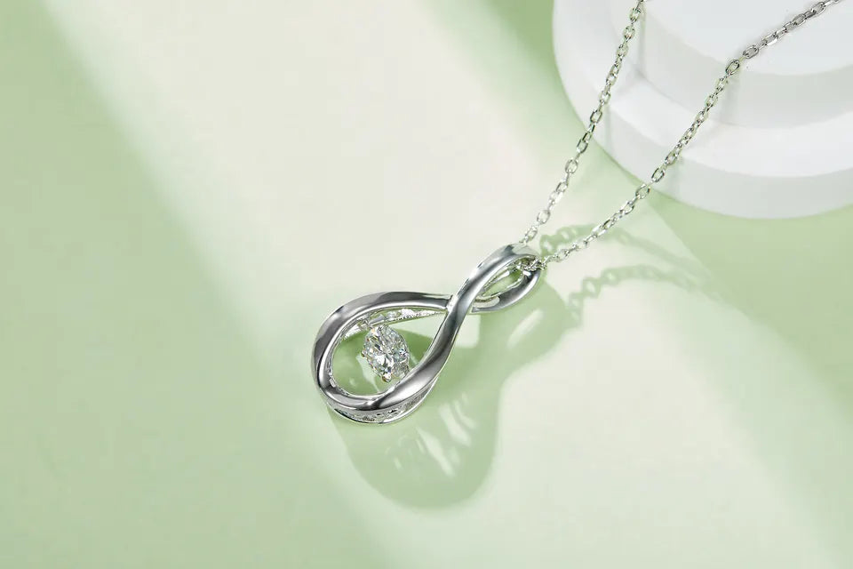 Spiral Dancing Moissanite Pendant Set in Sterling Silver
