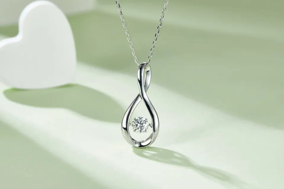 Spiral Dancing Moissanite Pendant Set in Sterling Silver