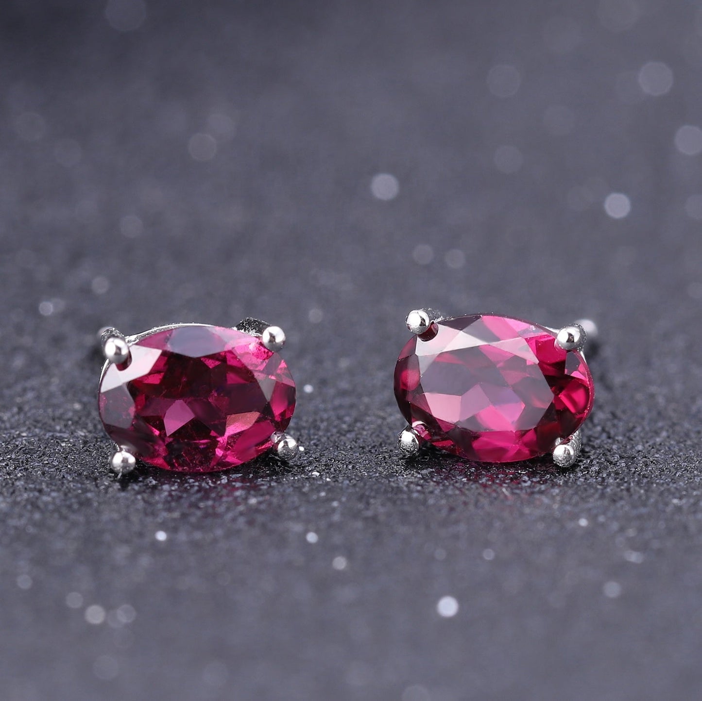 Rhodolite Garnet 0.60ct Oval-Cut Solitaire Stud Earrings