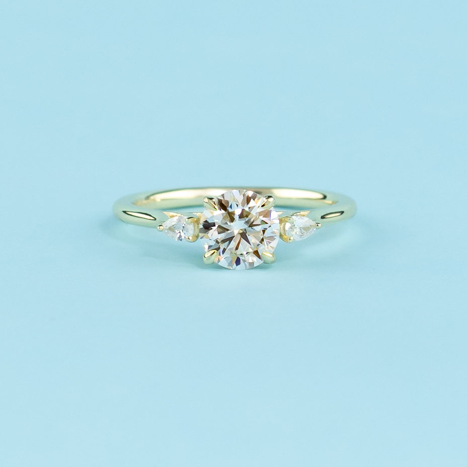 Trinity Round Brilliant Moissanite Engagement Ring Set in 9ct Yellow Gold