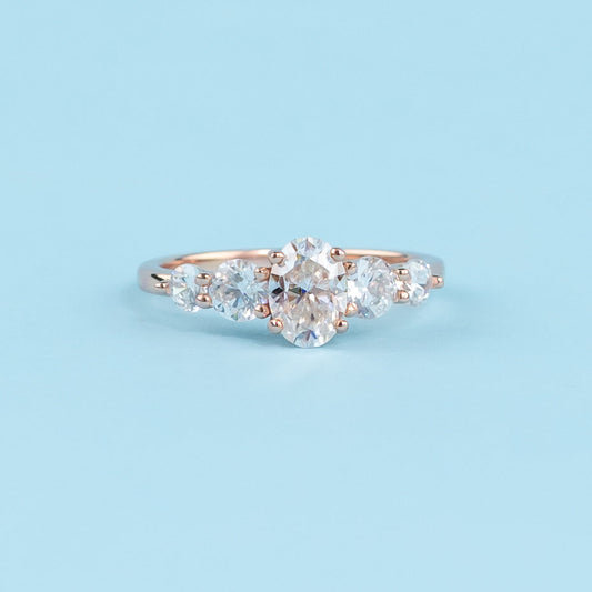 Five-Stone Oval Cut Moissanite Engagement Ring Set in 9ct Rose Gold
