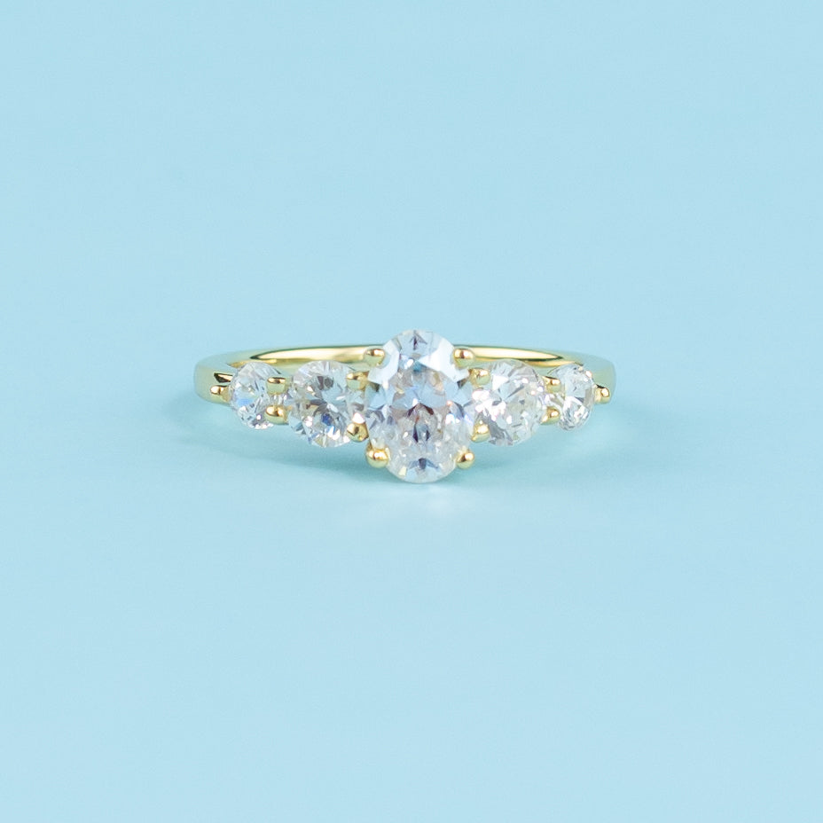 Five-Stone Oval Cut Moissanite Engagement Ring Set in 9ct Yellow Gold