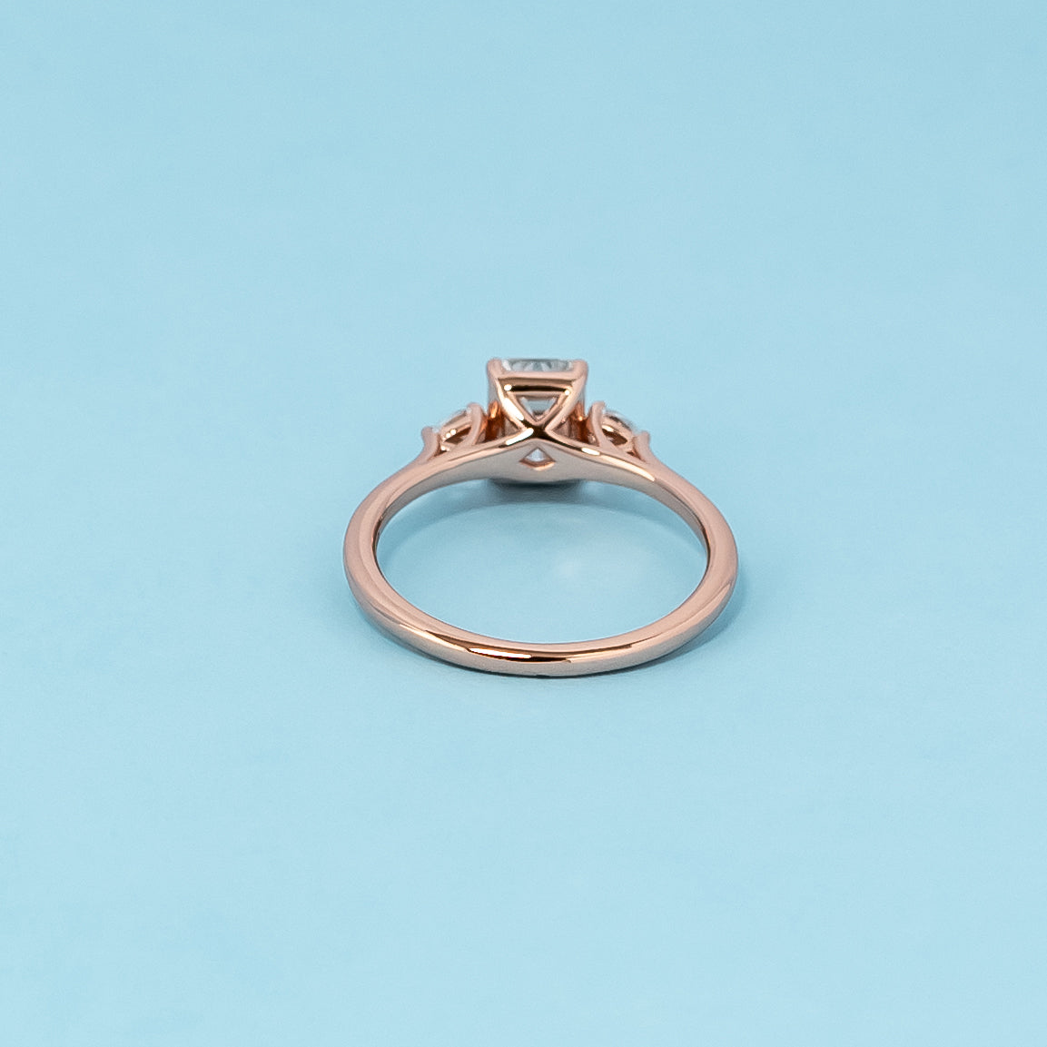 Trinity Emerald Cut Moissanite Engagement Ring Set in 9ct Rose Gold