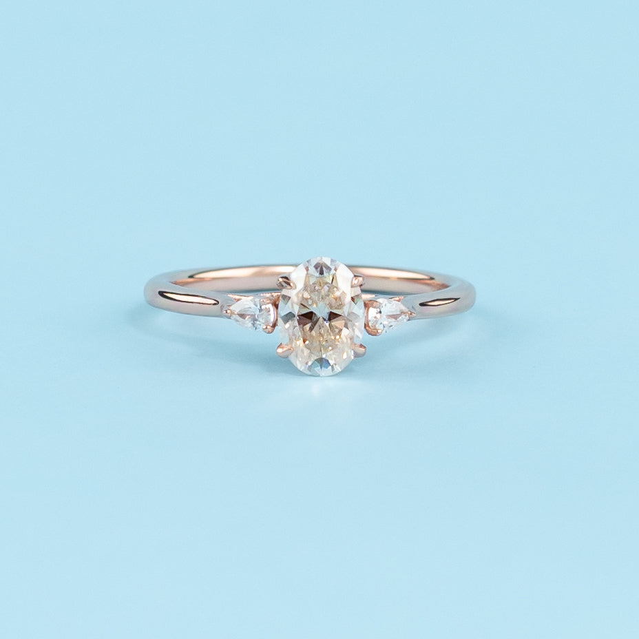 Trinity Oval Cut Moissanite Engagement Ring Set in 9ct Rose Gold