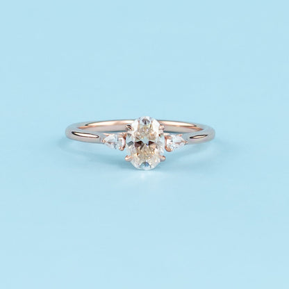 Trinity Oval Cut Moissanite Engagement Ring Set in 9ct Rose Gold