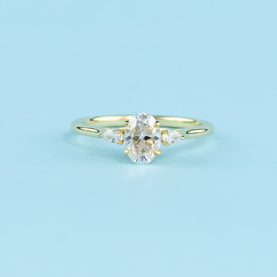 Trinity Oval Cut Moissanite Engagement Ring Set in 9ct Yellow Gold