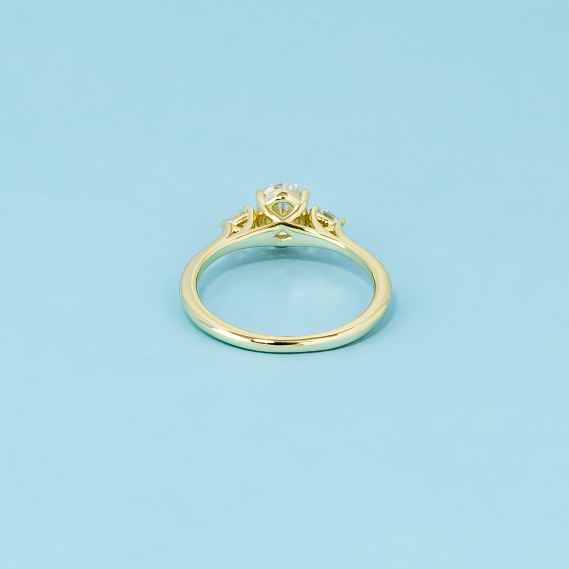 Trinity Oval Cut Moissanite Engagement Ring Set in 9ct Yellow Gold