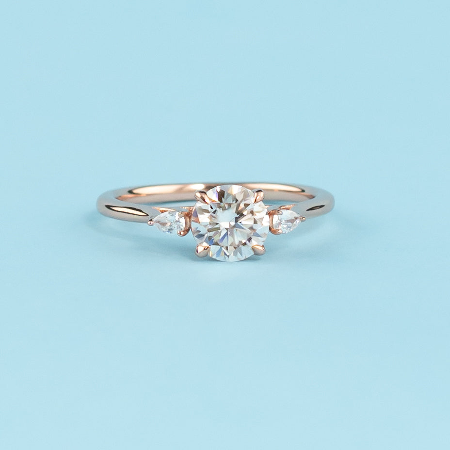 Trinity Round Brilliant Moissanite Engagement Ring Set in 9ct Rose Gold