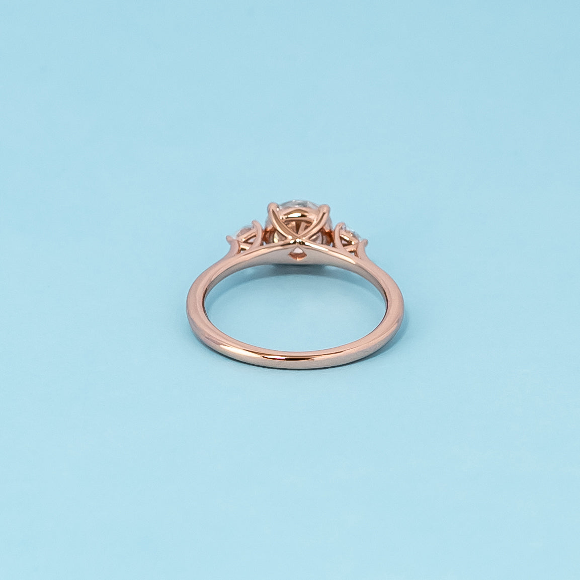 Trinity Round Brilliant Moissanite Engagement Ring Set in 9ct Rose Gold