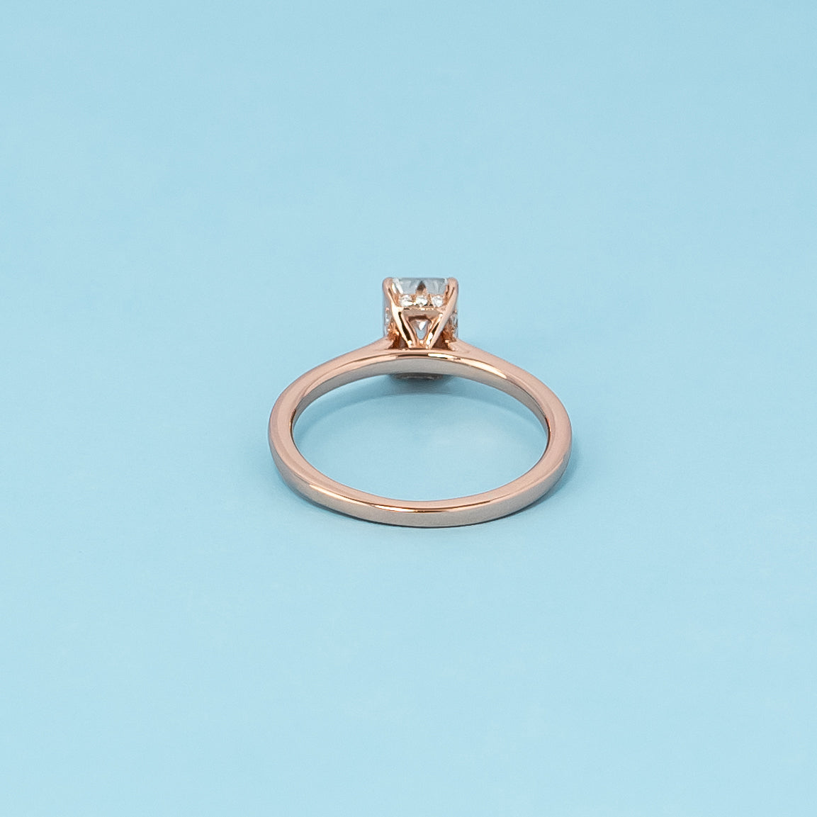 Hidden Halo Emerald Cut Moissanite Engagement Ring Set in 9ct Rose Gold