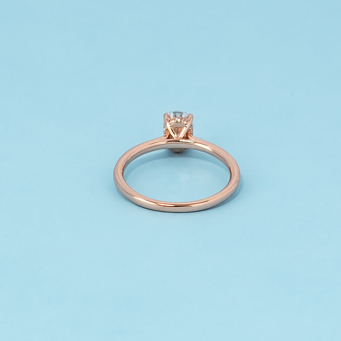 Hidden Halo Oval Cut Moissanite Engagement Ring Set in 9ct Rose Gold