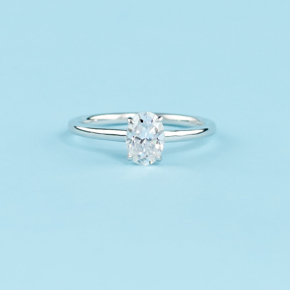 Hidden Halo Oval Cut Moissanite Engagement Ring Set in 9ct White Gold