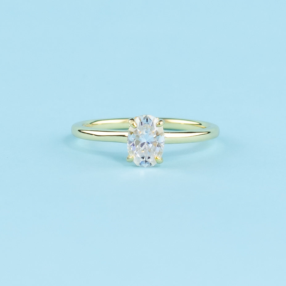Hidden Halo Oval Cut Moissanite Engagement Ring Set in 9ct Yellow Gold