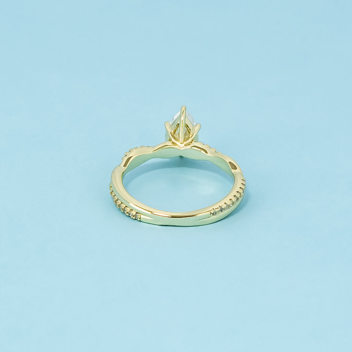 Spiral Pear Shape Moissanite Engagement Ring Set in 9ct Yellow Gold