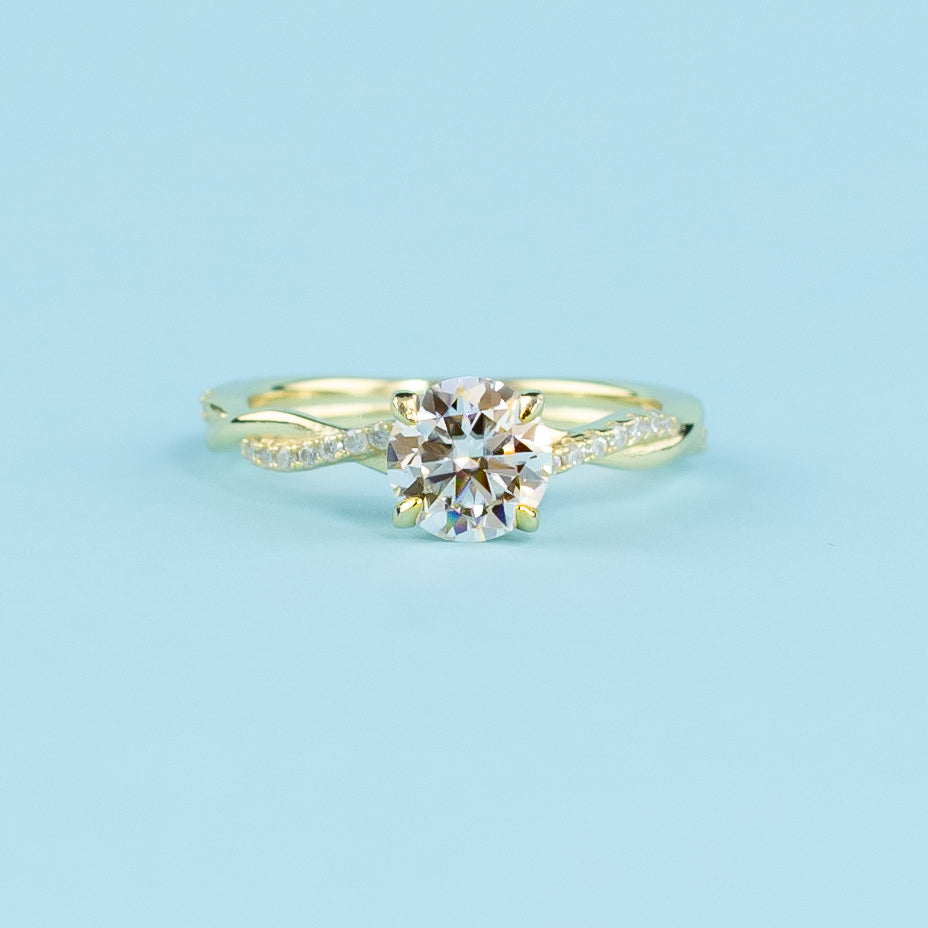 Spiral Round Brilliant Moissanite Engagement Ring Set in 9ct Yellow Gold