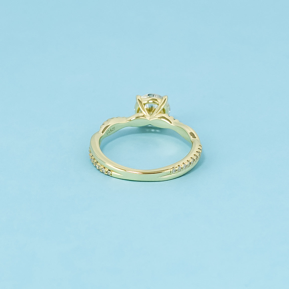 Spiral Round Brilliant Moissanite Engagement Ring Set in 9ct Yellow Gold